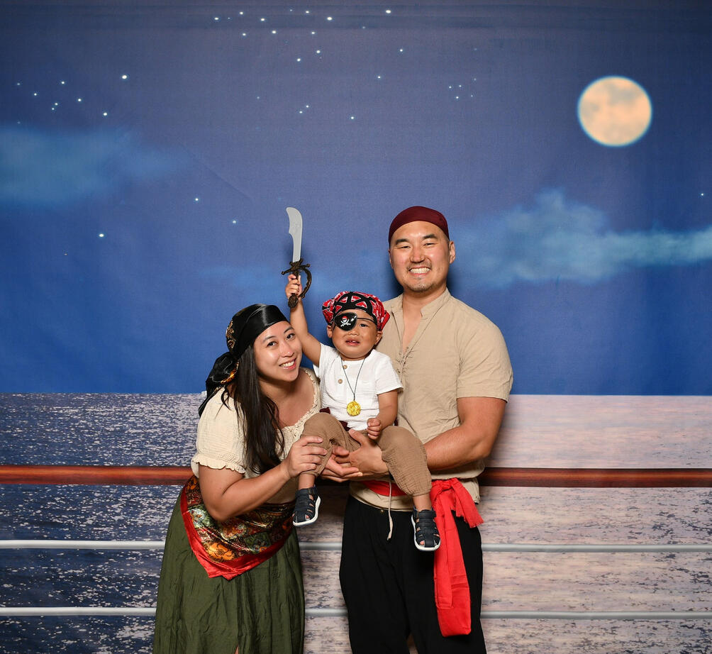My husband, son and I in pirate outfits on our first Disney Cruise